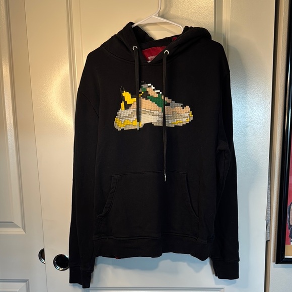 Mostly Heard Rarely Seen Black and Yellow Cartoon Graphic Sweater - Picture 1 of 12